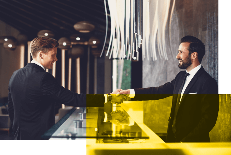 Friendly,Greeting.,Positive,Bearded,Young,Receptionist,Standing,At,The,Desk