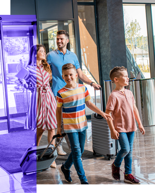 happy family walking into a hotel