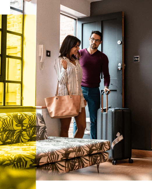 couple walking into vacation rental