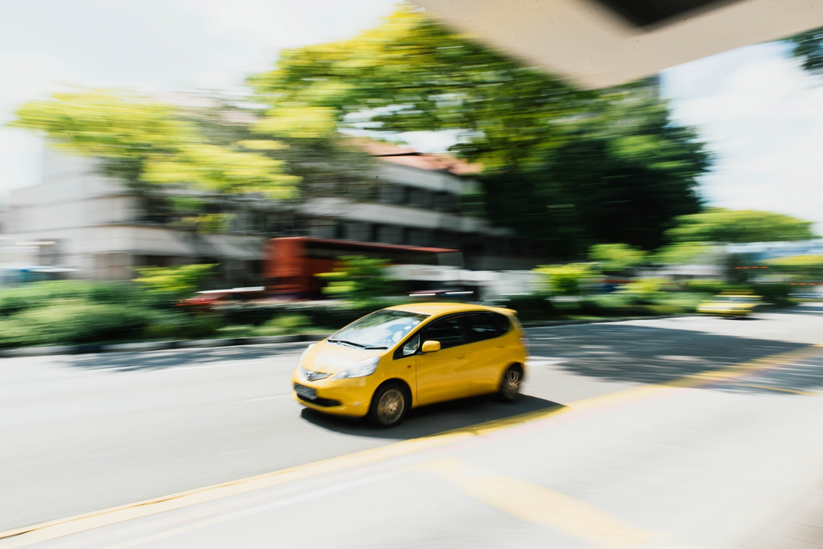 yellow car driving