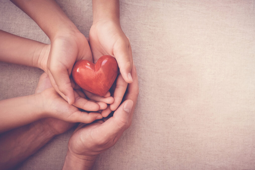 holding heart in hand