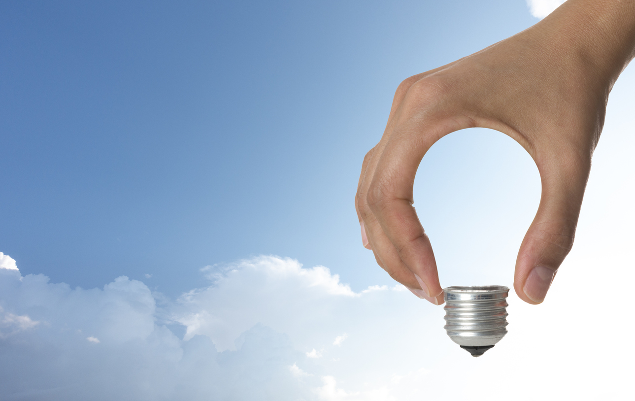 Light bulb in human hand